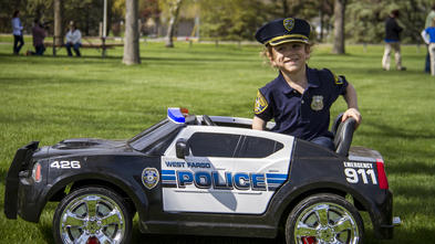 Kajj with mini police car