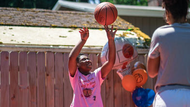 Audrianna Shooting a Basketball