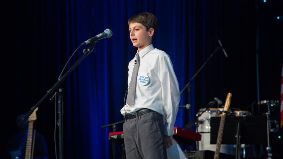Wish kid Ryland Mishura, age 11, gives a weather forecast to start the evening’s program
