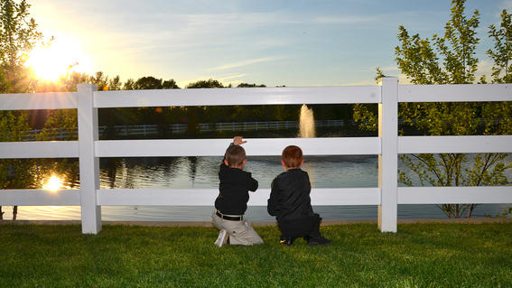 Children look out at the Pond of Hope.