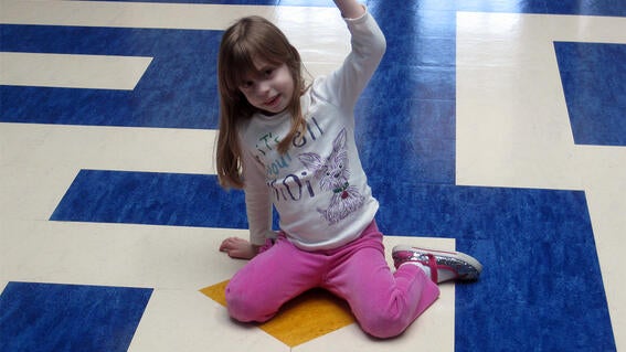 Victory pose after conquering the floor maze!