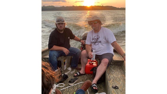 Jack and his dad on his wish boat