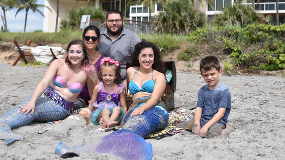 Anna and her family meet the mermaids on the beach