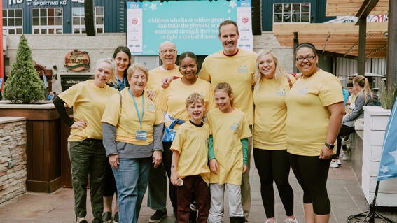 Group of volunteers smiling at the Walk for Wishes annual event