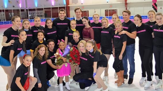 Nicole poses on ice with her wish granters