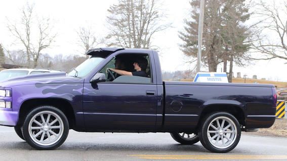 Matt driving off in his restored truck.