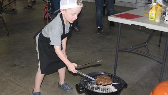 boy cooking grey shirt