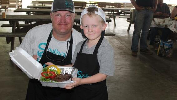 dad with son at BBQ