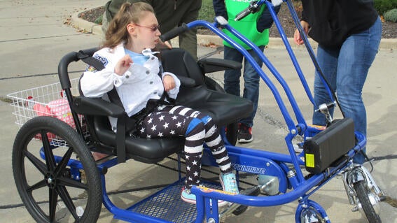 Emili receiving her bike