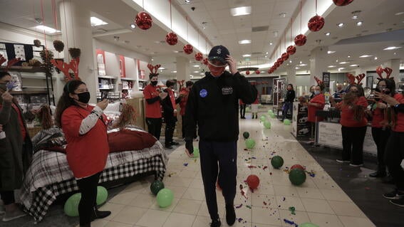Harry being welcomed by Macy's.