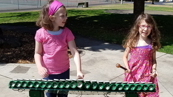 Mimms and Carleigh play the xylophone.