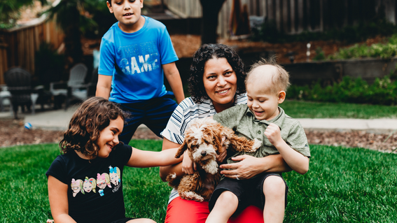 jonny and his family pose with puppy