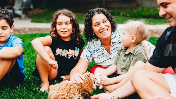 jonny and his family pose with puppy