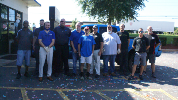 The team of community partners gather with Michael.