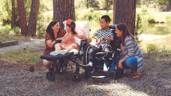 Wish kid Dana with her mom, her best friend Nixon, and Nixon's mom