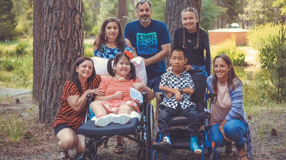 Wish kid Dana and her family with her best friend Nixon and his family