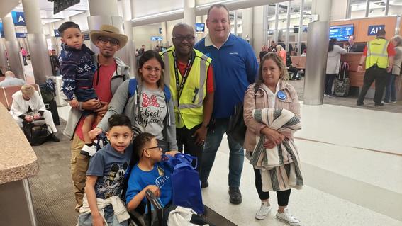 Volunteer Matt at airport with Wish Kids.