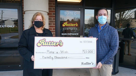 Pictured here is Make-A-Wish York Regional Director Ann Waltman, accepting a $20,000 donation from Chris Hartman, Director of Fuels, Forecourt & Advertising. 