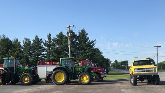 tractors line up for a parade