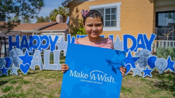 Allison holding make-a-wish sign
