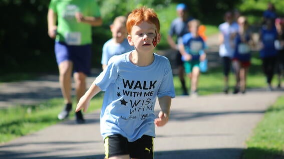 Wish kid David running at Walk For Wishes Twin Cities 2019