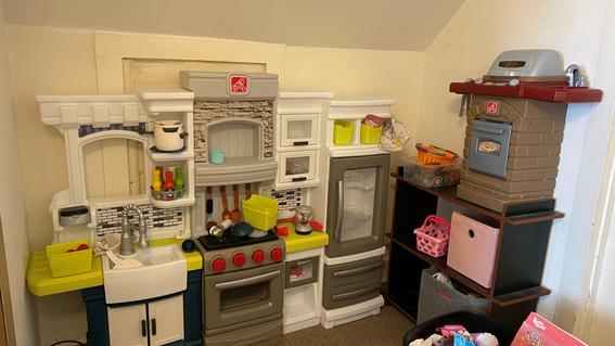 Penelope's play kitchen sitting in her bedroom.