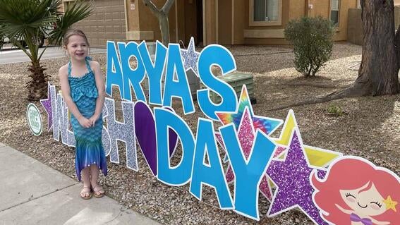 Arya and her special Card My Yard sign for her wish day.
