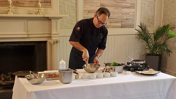 Chef Marc Collins prepares a freshly salad in an exclusive cooking lesson for culinary experience patrons.