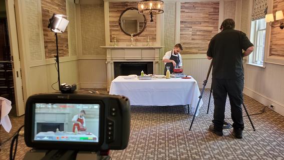 Chef Steven Manall filming exclusive cooking lesson for culinary experience patrons.