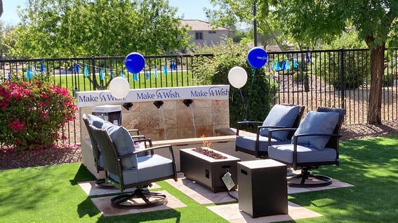 Kylie's backyard decorated with balloons for her wish.