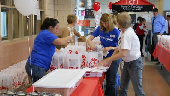Volunteers setting up lunch service
