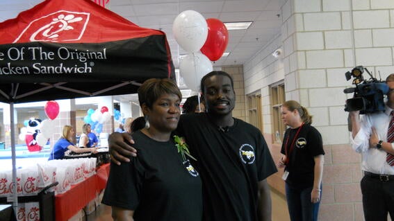 Rashawn and his mom at his wish