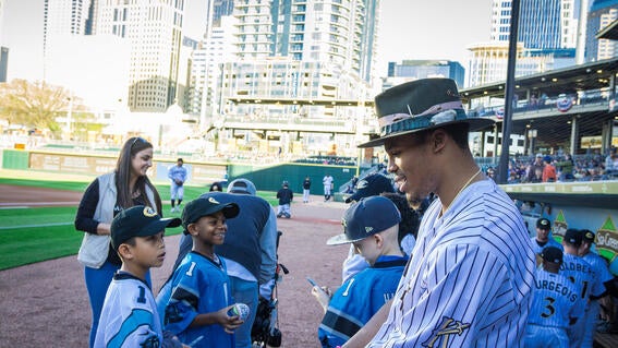 Cam talking to wish kids at baseball game
