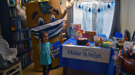 Sophia and HEBuddy inside with her presents.