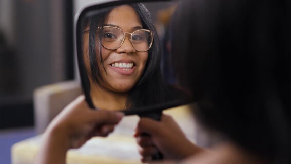Chairalis sees new smile for the first time
