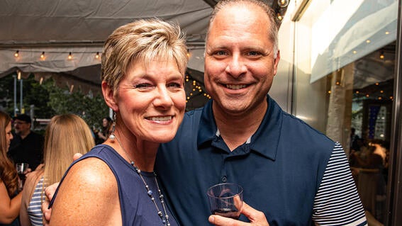 Guest attending the event outside of Eddie Merlot's on the garden patio.
