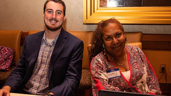 Jake Seavy Make-A-Wish Development Coordinator with Make-A-Wish Volunteer Shelley at the registration table. 