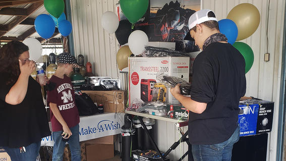Noah checking out all his brand new welding supplies and tools.