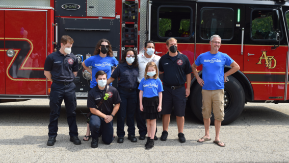 wish child Mazie with family and firefighters