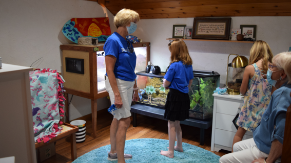 Grandmothers and a friend in Mazie's room