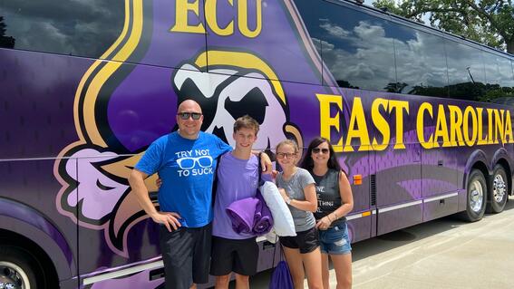 Jackson and his family today in front of an ECU bus.