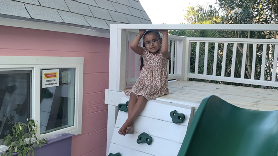 Alessandra loves her slide and rock wall!