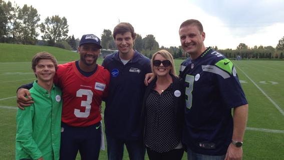 Wish Alumni Coby and his family meeting Russell Wilson