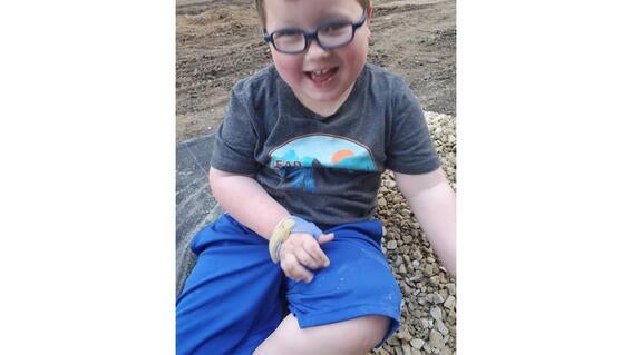 Greyson playing in backyard