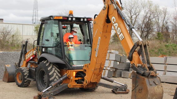 Nicholas in a backhoe 