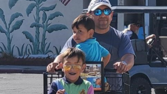 Leo and family having fun in shopping cart