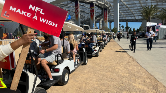 Caleb and group in golf carts