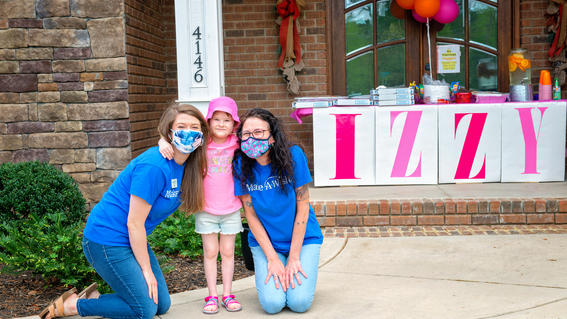 Izzy with her wish granters in front of her custom table