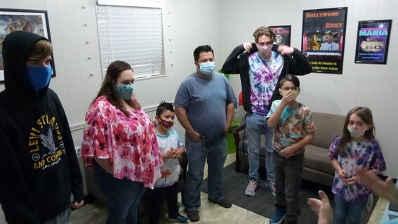 Levi and his family in the instruction room
