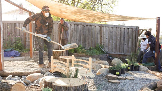 Volunteers help with backyard makeover